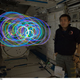 Illustration for article titled Japanese "Spiral Top" makes zero-gravity light paintings aboard the ISS